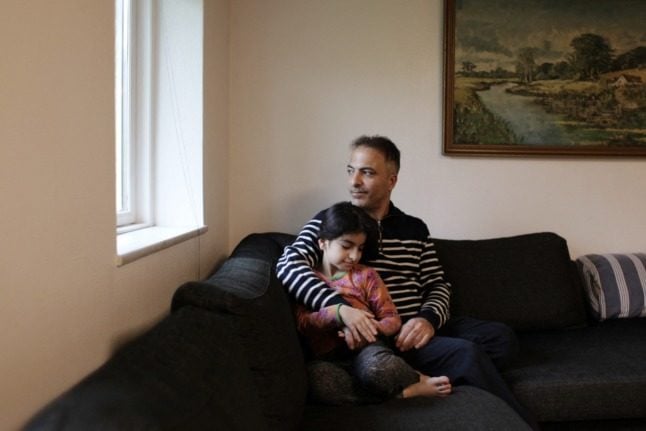 Syrian refugee Bilal Alkale and his daughter Rawan at their home in Lundby, Denmark on November 17th 2021. 