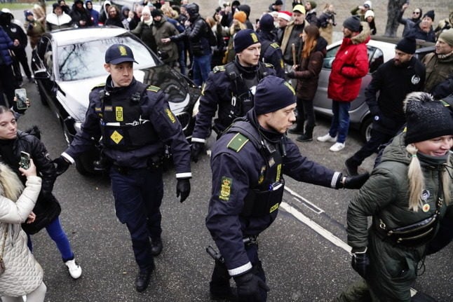 Danish police and protestors at Frederiksberg court on Thursday. 