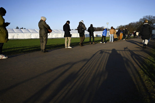 High Covid-19 infection rates are casting a shadow over the end of 2021 in Denmark. People queue for testing in Copenhagen on December 16th.