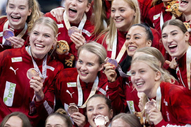 Denmark's women's national handball team celebrate on Sunday after taking third place in the World Championships.