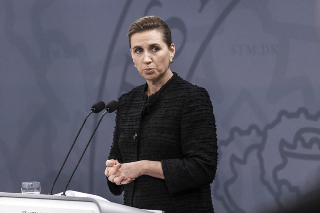 Danish Prime Minister Mette Frederiksen said that Covid-19 including the Omicron variant remains a threat to Denmark, after some upbeat recent messaging from health officials.