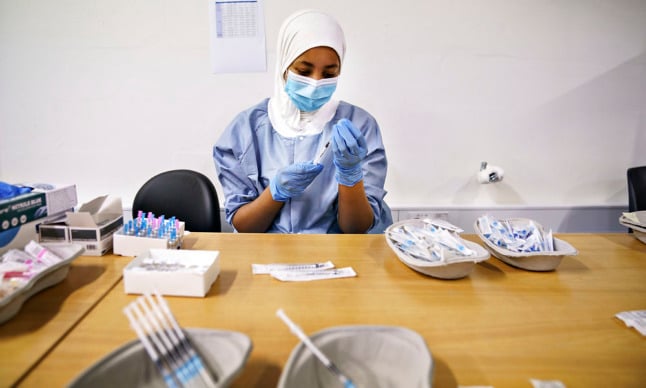 Staff prepare Covid-19 vaccines at a vaccination centre in Aalborg on January 3rd 2022. Denmark currently has its highest number of Covid patients in hospitals since early 2021.